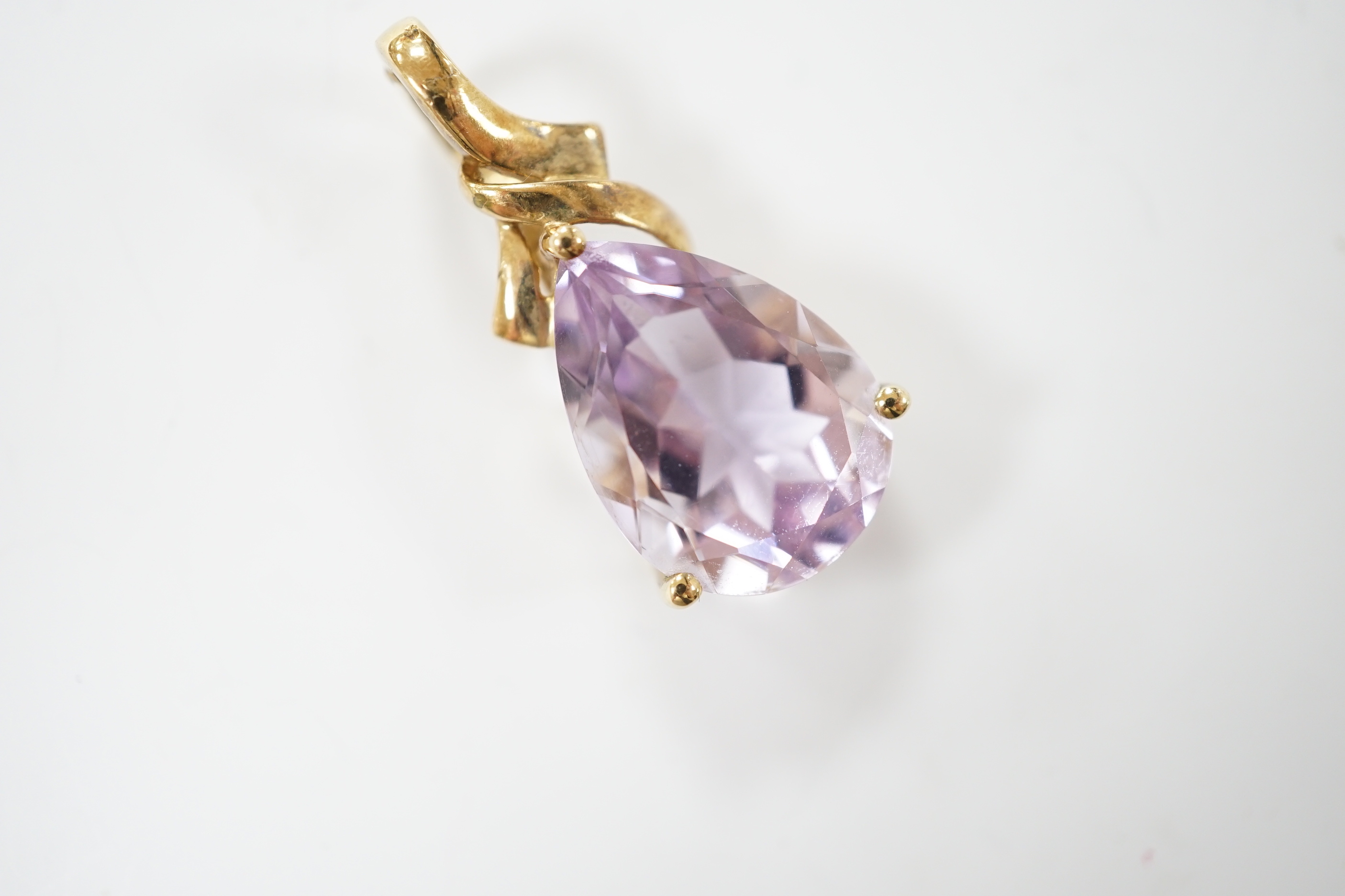 A modern 9ct gold and pear cut amethyst set pendant, 30mm, gross weight 3.9 grams.